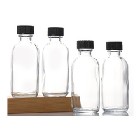 Vente en gros d'emballages de boissons ronds vides 2oz de lait/jus/thé/boisson bouteilles de shot de gingembre en verre 60ml avec bouchons pour affaires de jus
