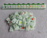 Jeu de tuiles de mahjong de luxe inspiré du verre marin, style côtier américain, avec motifs Vents de marée haute, Dragons requins taureaux, Dauphins et Jokeres coquillages.