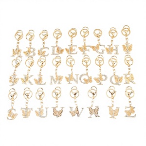 Offre Spéciale : Porte-clés et Pendentif de Sac de Luxe en Alliage de Zinc avec Lettre Originale et Cristal, Motif Papillon - Product Image 1