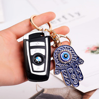 Porte-clés main Hamsa en émail à la mode exquis avec porte-clés de décoration de sac en alliage incrusté de strass de conception du mauvais œil