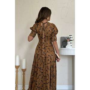 Robe de soirée trapèze en mousseline Moccah avec encolure à nœud, taille naturelle et design enveloppant confortable - Product Image 1