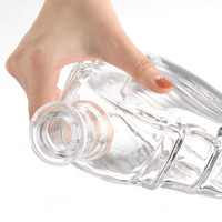 Bouteilles en verre vides personnalisées transparentes pour la validation des emballages de nouveaux produits (bourbon, vodka, spiritueux)