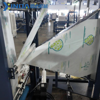 Machine de fabrication de sacs en non-tissé entièrement automatique à découpe en W, contrôlée par PLC, entraînée par moteur et moteur électrique, haute vitesse, pour sacs T-shirt et sacs de courses réutilisables