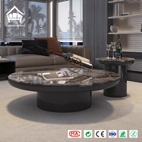 Table basse moderne en marbre rond avec base en piédestal noir, table centrale personnalisée, solution tout-en-un pour le mobilier de salon