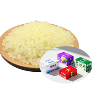 Adhésif thermofusible en résine EVA granulaire jaune clair à séchage rapide pour emballage carton et transport, temps de durcissement 3-5s