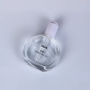 Botol Kaca Penetes Minyak Penumbuh Label Kustom 50Ml Bulat Datar Transparan untuk Minyak Rambut