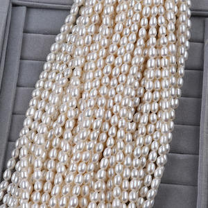 Perles d'eau douce naturelles de forme de riz blanc de 6 à 7 mm, perles Zhuji dispersées pour la fabrication de bijoux, vente en gros colorée - Product Image 1