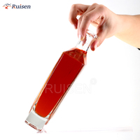 Bouteilles en verre d'emballage de palettes à fond épais en liège en forme de spiritueux de whisky plat haut de gamme de luxe de 650ml