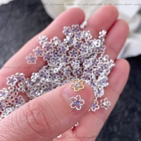 Paso Sico Best-seller transfrontalier Mini embellissements pour nail art en alliage en forme de fleur à cinq pétales, strass scintillants et colorés pour ongles