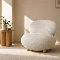 Fauteuil lounge moderne en tissu bouclé de style nordique avec pieds en bois, fauteuil d'appoint au design incurvé en forme de galet pour salon et chambre à coucher