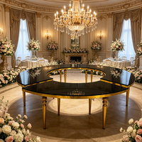 Table de salle à manger circulaire de luxe en acier inoxydable noir et or pour location, idéale pour les mariages