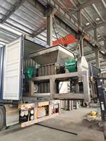 Déchiqueteuse de recyclage de pneus en plastique Prix de la machine Déchiqueteuse à double arbre de ferraille de palettes en bois et de textiles en acier