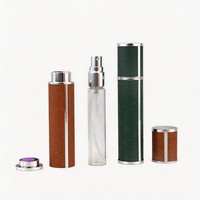 Vente en gros d'atomiseurs de parfum en verre enveloppés de cuir de luxe, cylindriques, avec bouchon rotatif, 5 ml, 10 ml, mini flacon de voyage rechargeable, logo personnalisé