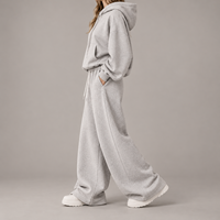 Ensemble de survêtement décontracté pour femme, personnalisé OEM, avec sweat à capuche et pantalon de survêtement à jambes larges, couleur unie, coupe oversize, fabricant de marque privée