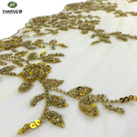 Dentelle florale dorée populaire avec broderie perlée et sequins pour robe de mariée de luxe sexy, 100 % polyester