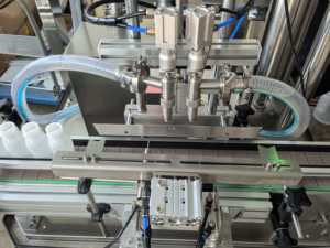 Machine <span class=keywords><strong>de</strong></span> remplissage <span class=keywords><strong>de</strong></span> bouteilles à double tête multifonctionnelle à haute précision pour pâtes, liquides et boissons - Product Image 6