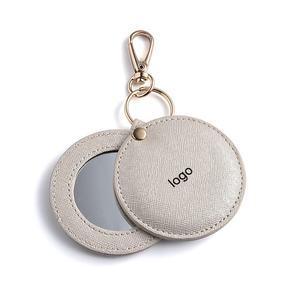 <b>Small</b> <b>Round</b> White Keychain Pendant Double Sided Rotatable Embossed PU Leather Portable Makeup <b>Mirror</b> - Product Image 1