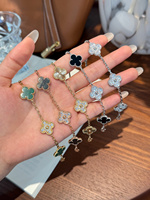 Bracelet trèfle à quatre feuilles en or jaune 18 carats / or blanc, coquille multicolore et pierres précieuses, bijoux fins porte-bonheur
