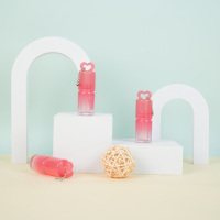 Caractéristiques uniques Tubes de brillant à lèvres vides roses Tube de brillant à lèvres mignon rond Bouteille de rouge à lèvres 3ml avec porte-clés