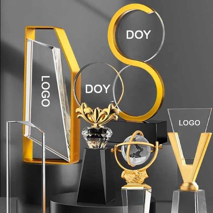 A shiny gold trophy with a blank nameplate sits on a podium The trophy
