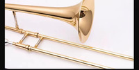 A Brass Lacquered Gold Trombone Instrument with case in the Flat B Tone of the Baritone