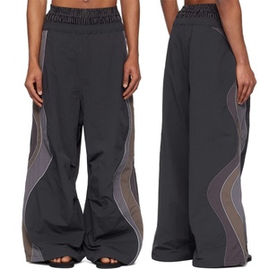 กางเกงวอร์มขาบานทรงหลวมขนาดใหญ่พิเศษ ผ้าไนลอน แต่งแถบลายทาง สไตล์ลำลอง สำหรับผู้ชาย - Product Image 1