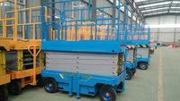 Plateforme élévatrice mobile à ciseaux à prix d'usine pour le levage vertical de marchandises en intérieur et en extérieur