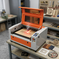 Machine de découpe et de gravure laser CO2 Supercnc 40W/60W, refroidie par eau, sur table, avec tube laser Reci, contrôle Ruida, DST, prix compétitif