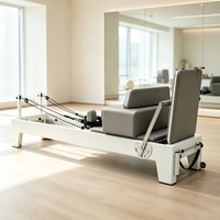 Reformer de Pilates en bois massif peint avec coussin en cuir PU haute densité pour l'entraînement de Pilates en studio ou à domicile