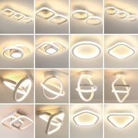 Plafonnier LED géométrique moderne en or avec anneaux entrelacés en acrylique pour salon