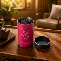 Boîte à thé ronde en métal rose personnalisée avec couvercle noir uni et motif floral blanc pour l'emballage de thé en vrac de qualité supérieure