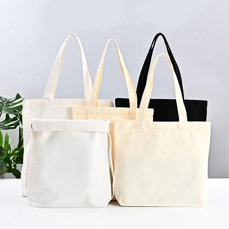 कस्टम मुद्रित 12 ऑउंस कॉटन कैनवास टोट शॉपिंग बैग पुनर्नवीनीकरण सफेद काला प्राकृतिक रंग सादा जिपर पॉकेट लेडी पुन: प्रयोज्य पैकिंग