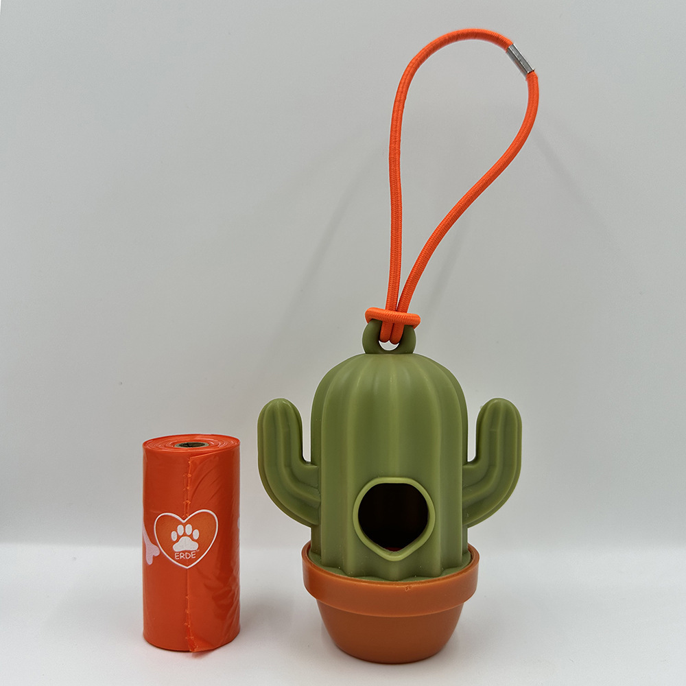 Dispenser + orange rubber band + 1 roll of bags
