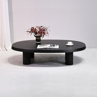 Table basse moderne en bois noir à profil bas, table à thé ovale avec pieds cylindriques, meubles de salon