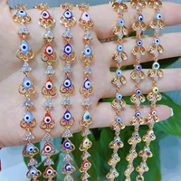 Bracelet en cuivre plaqué or en gros, serti de micro-diamants VVS Zircon, style Ice Out, avec breloque œil baguette pour femme