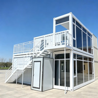 Bâtiment modulaire préfabriqué à deux étages en conteneur, avec grande façade vitrée, pour bureau, hall d'accueil de chantier de construction et espace de réception
