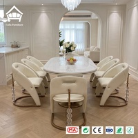 Ensemble de table à manger ovale de luxe avec accents en cristal et 6 chaises rembourrées, idéal pour l'ameublement de villas, hôtels et restaurants