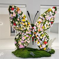 Arc de papillon de rangée de fleurs artificielles réalistes faites à la main pour décor de boutique de toile de fond de mariage caractéristique de Noël