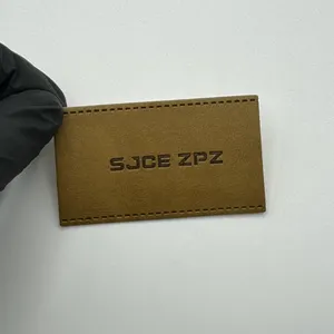 Light brown simple leather label tags for jeans with debossed hot stamp brand logo durable recycled pu leather patches