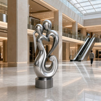 Sculpture d'art abstrait moderne en acier inoxydable poli miroir, motifs ajourés complexes, forme circulaire pour parcs et villas