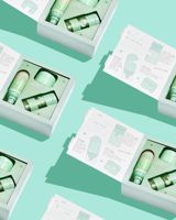 Emballage de boîtes en carton de kit de soin de la peau de lotion de type livre avec logo personnalisé