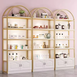 Étagère de présentation cosmétique de luxe avec cadre doré, présentoir autoportant arqué avec <span class=keywords><strong>armoire</strong></span> de rangement pour les boutiques de beauté - Product Image 2