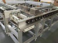 Transportador de Cadena de Rodillos Acumuladores para Línea de Ensamblaje de Automóviles Eléctricos en Planta de Fabricación