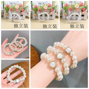 Juego de pulseras con lazos para el cabello de perlas blancas, en forma de corazón, estilo coreano informal, empaquetado individualmente, primavera 2023 - Product Image 1