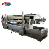Machine de friture continue à convoyeur en maille, ligne de friture grande capacité pour la transformation de nuggets de poulet, de nuggets de poisson et d'arachides