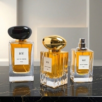 Flacon de parfum de luxe en verre carré 50ml/100ml, design rectangulaire ondulé unique, bouchon en forme de pierre ovale, pulvérisateur à pompe, article de luxe en stock