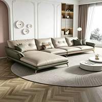 Ensemble de canapés d'angle en cuir véritable confortable et personnalisé de style européen, avec des pieds en métal doré élancés
