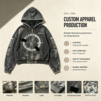 Sweat à capuche oversize zippé avec bords bruts, finition délavée et broderie patchwork, style streetwear décontracté