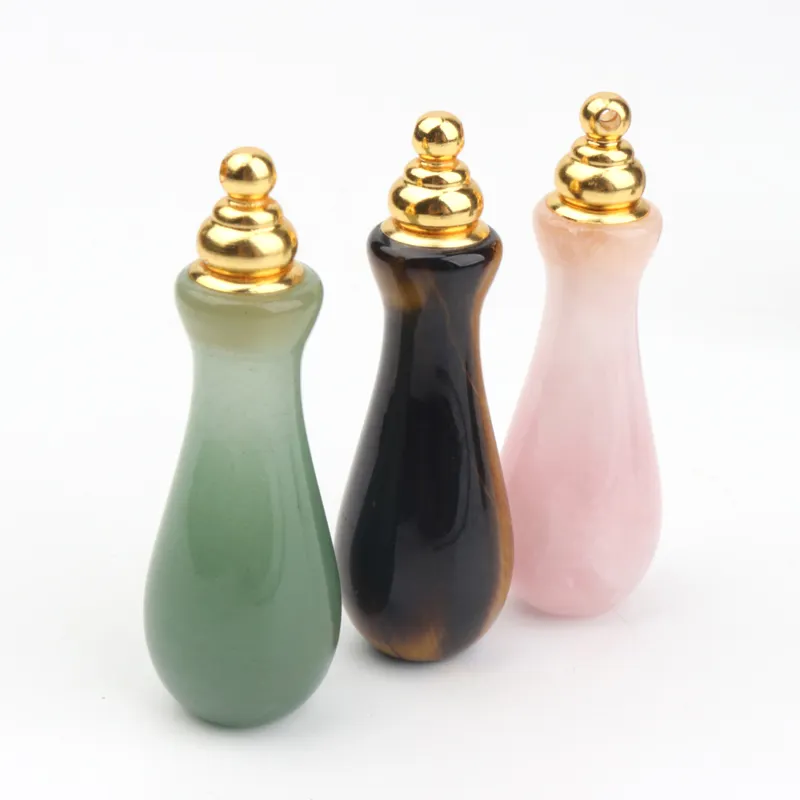 wholesale custom design natural rock crystal stone hand carved empty perfume bottle Oil Bottles