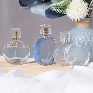 Bottiglia di profumo vuota trasparente di lusso 50ml piatta e rotonda bottiglia di vetro con spray